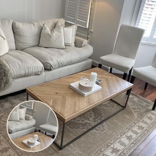 beige toned coffee table paired with white sofa