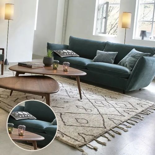 mahogany coffee table with dark accent green sofa
