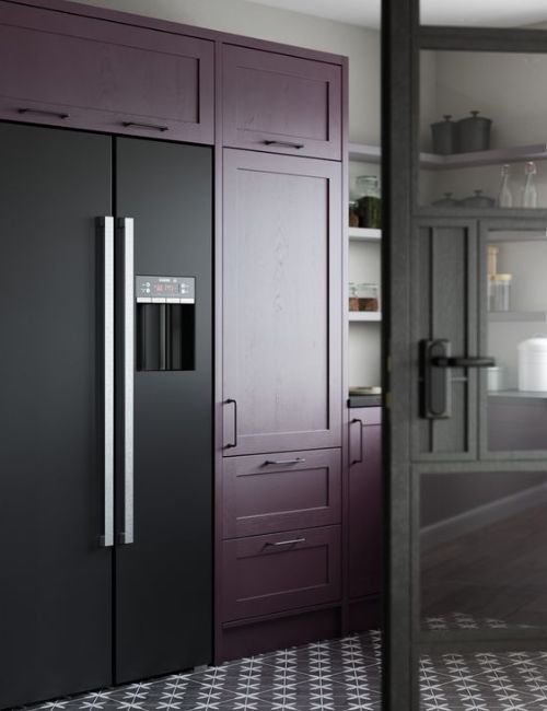 purple kitchen with black appliances