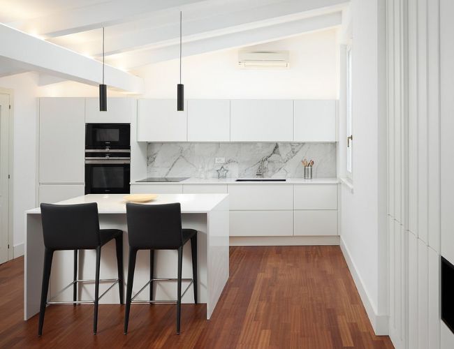 white kitchen with black appliances