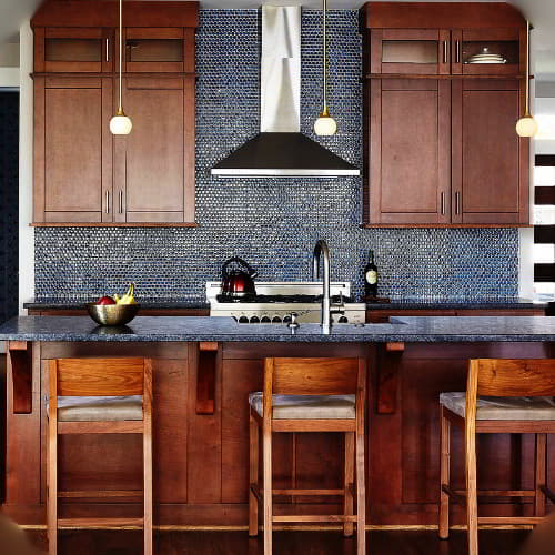 brown cabinets with blue tiles