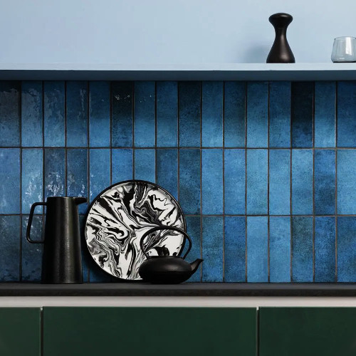 green cabinets and navy blue tiles