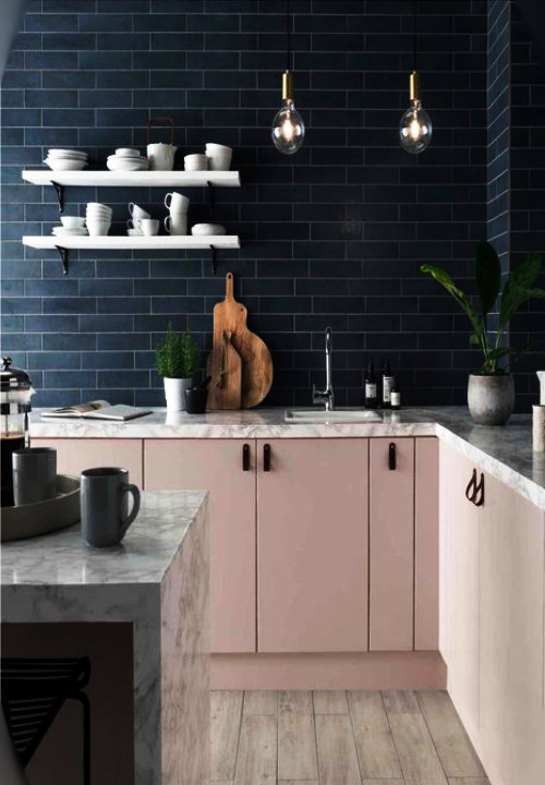 pink cabinets and navy tiles