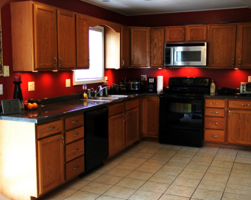 red with light wood cabinets